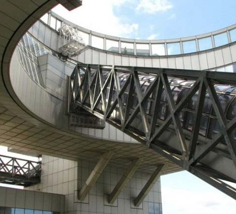 A circular atrium piercing the roof and upper levels of the building is 