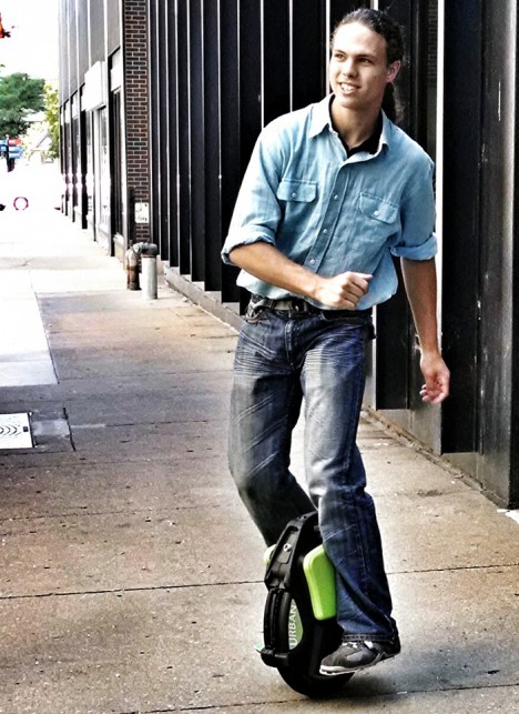 unicycle city street sidewalk