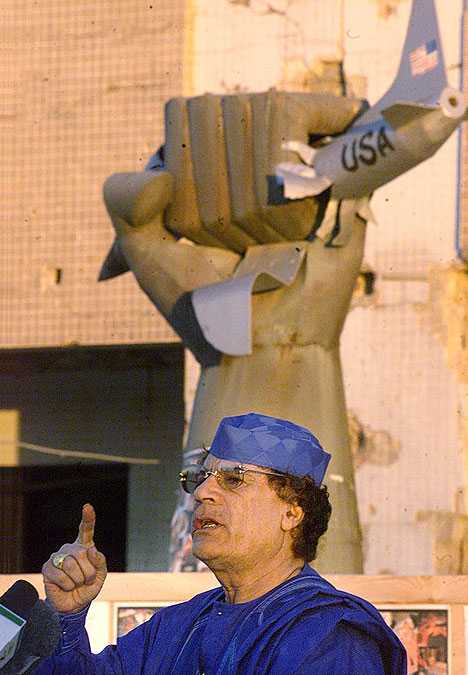 smashed statue Gaddafi Libya U.S fighter plane sculpture
