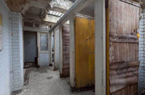 deserted underground bathroom stalls