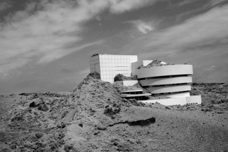 guggenheim half buried sand