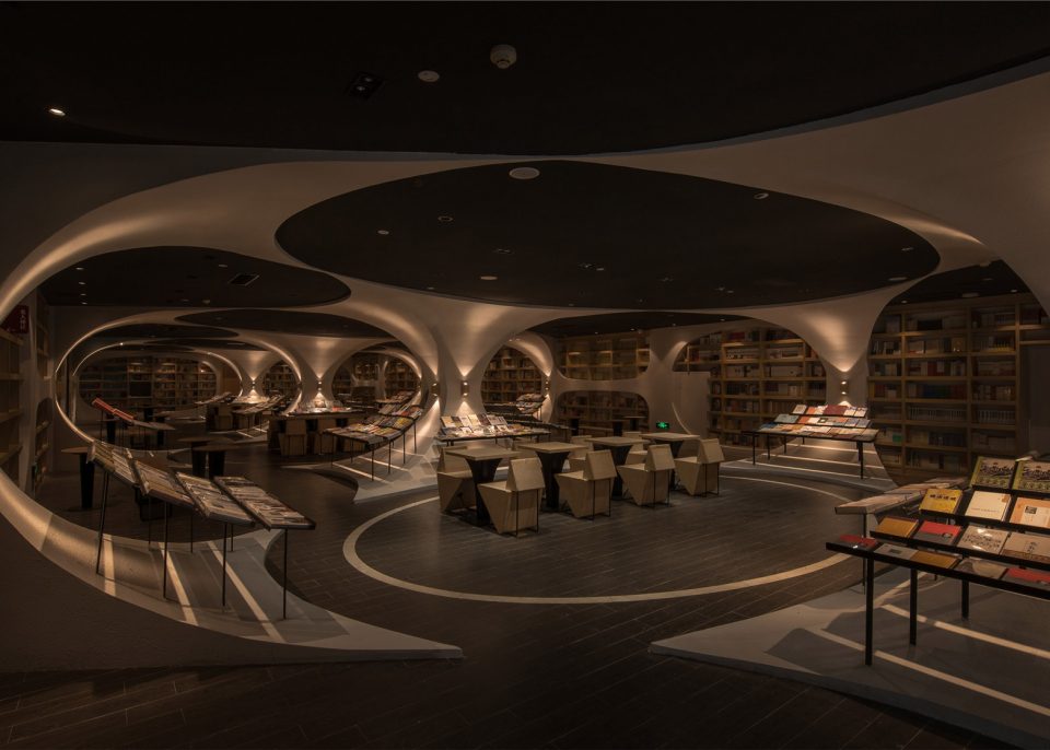 Tunnel of Books Shelves Wrap Curved Bookstore Walls & Ceiling Urbanist