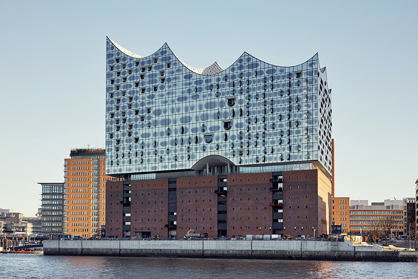 Glittering Wave-Shaped Concert Hall Placed Atop Old Warehouse Building ...