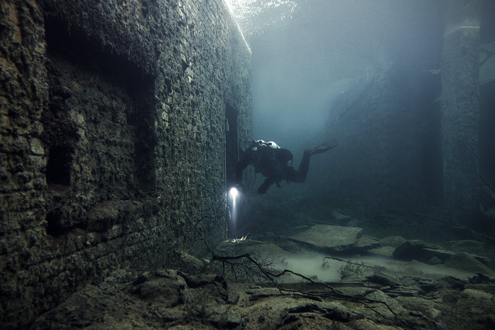 Urban Explorers Scuba Dive Through an Abandoned Submerged Soviet Prison